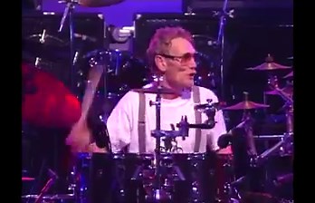 Inductee Ginger Baker’s explosive, expressive drumming propelled Cream to great heights. His fiery mixture of jazz, blues, and psychedelic rock and roll drumming, along with his improvisational performances, defined the sound of a rock power trio. Baker’s creativity flourished in many collaborations and experiments across genres, continents and eras, and he influenced many who have occupied the drum throne. | Rock & Roll Hall of Fame