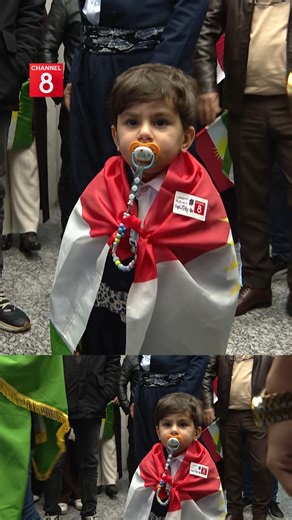 Still wrapped in the Kurdistan flag, the child arrived at Channel8 headquarters, where staff welcomed him with warmth and applause. | Channel 8 English